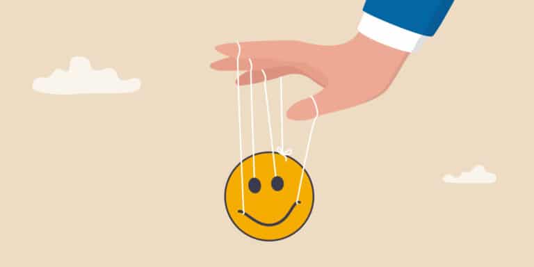 Illustration af en hånd der holder nogle snore der sidder fast på en smiley